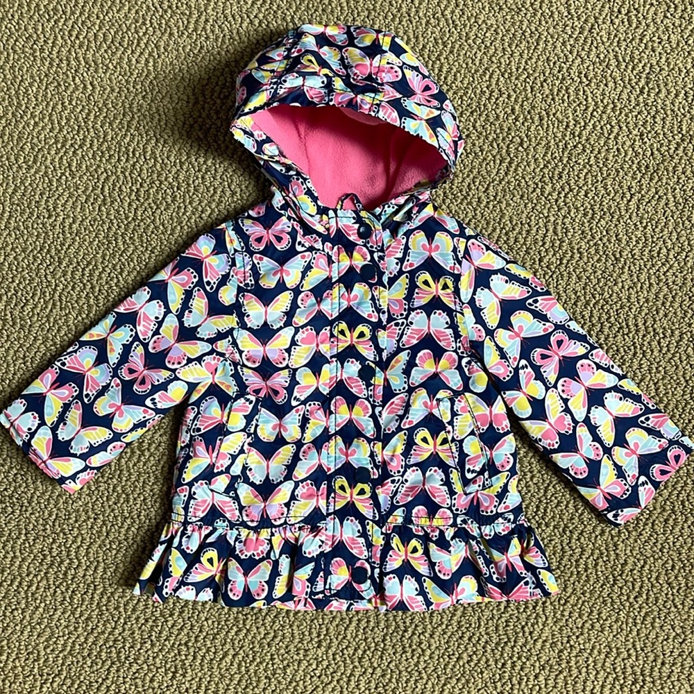 Carter’s size 12 months light rain jacket. Pink fleece on the inside.